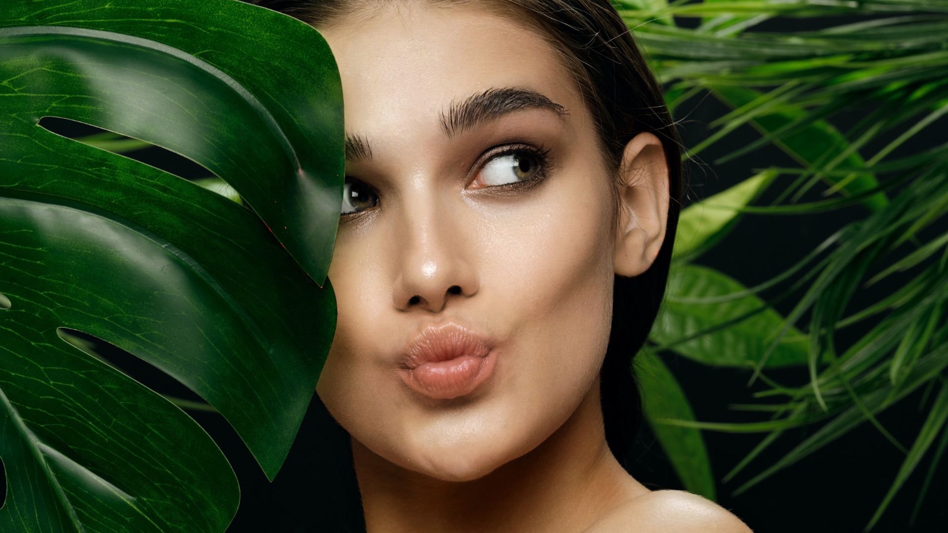 Lip Fillers in Dubai - Woman Pouting Between the Leaves