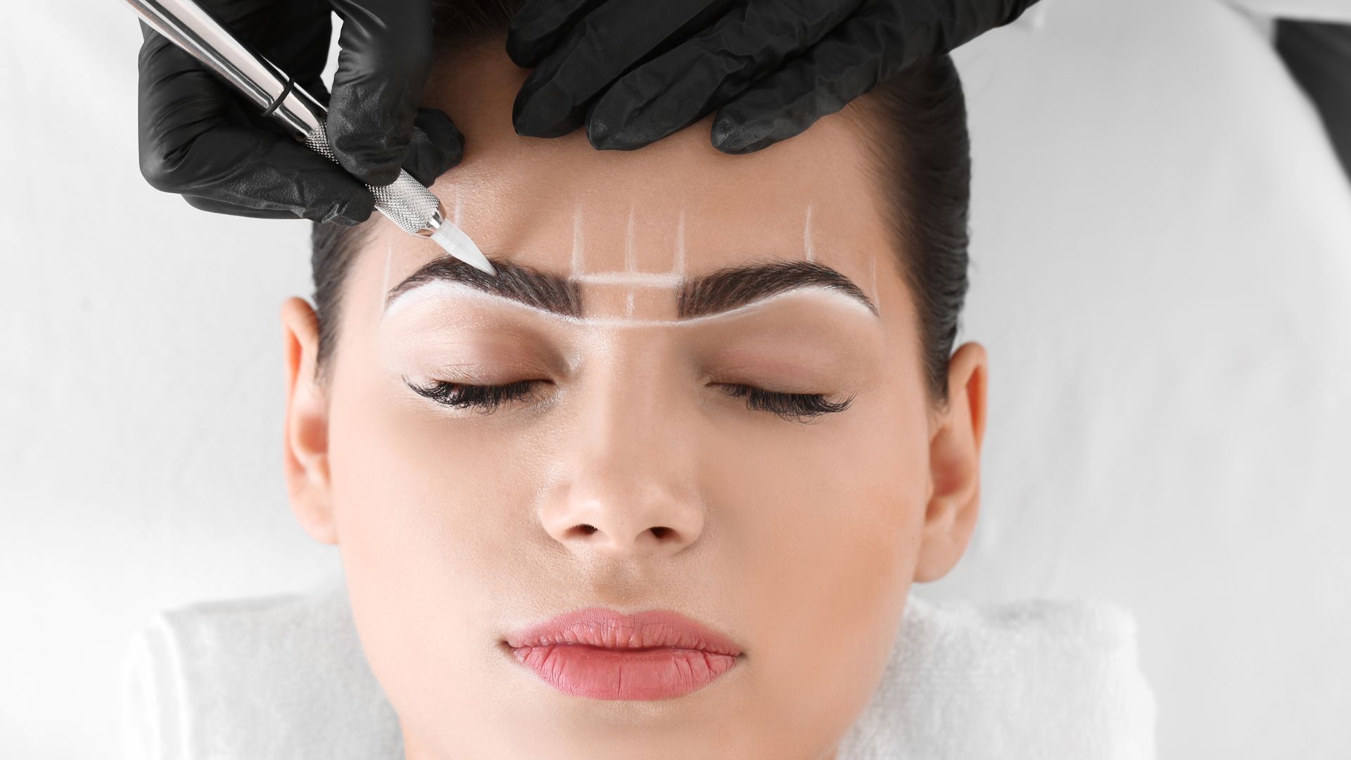 Eyebrow Lift in Dubai - Doctor Mapping a Woman's Eyebrow