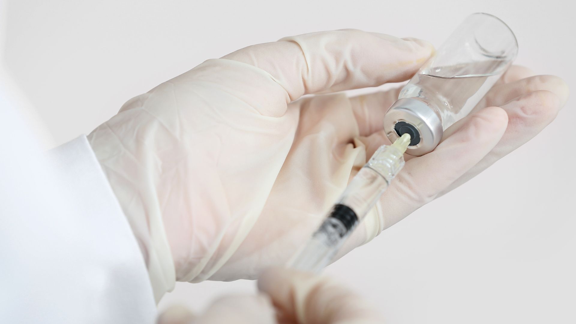 Doctor Holding Syringe - Buttock Enhancement