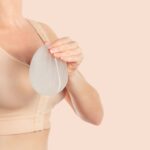 Breast Augmentation in Dubai - Woman Holding a Breast Implant