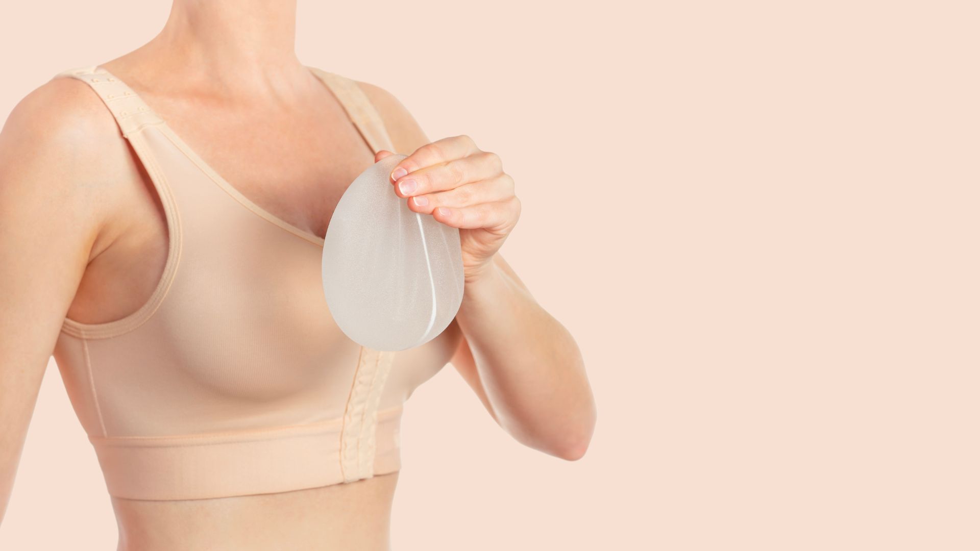 Breast Augmentation in Dubai - Woman Holding a Breast Implant